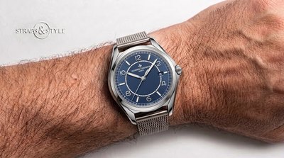 Vacheron Constantin with a blue sector dial, Maltese cross emblem, date at three and a sculpted steel case on a Straps&Style mesh bracelet