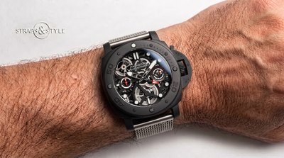 Panerai Submersible skeleton in a matte black case with an openworked movement, red GMT hand and day-night indicator on a Straps&Style mesh bracelet