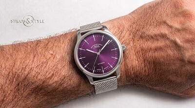Mühle Glashütte automatic with a sunburst purple dial, slim silver baton markers and a central sweep seconds hand on a Straps&Style mesh bracelet