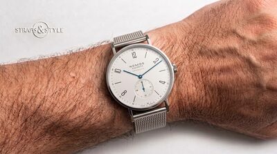 NOMOS Glashütte Tangente with a crisp white dial, alternating Arabic numerals, blued steel hands and a recessed small-seconds counter at six on a Straps&Style mesh bracelet