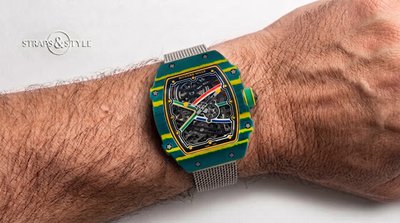 Richard Mille RM 67-02 ultra-thin tonneau watch in green composite with yellow striations and four coloured racing stripes across the movement on a Straps&Style mesh bracelet