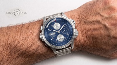Hamilton Khaki X-Wind chronograph with dark blue dial, slide-rule bezels and day-date window at nine on a Straps&Style mesh bracelet