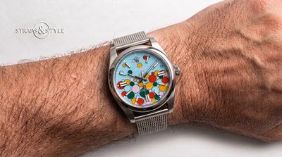 Rolex Oyster Perpetual with a light turquoise dial covered in multicoloured spheres on a Straps&Style mesh bracelet