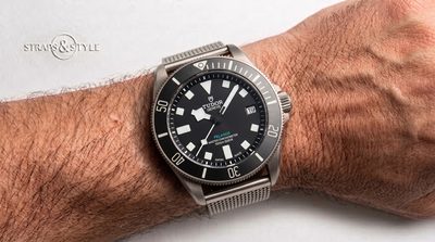Tudor Pelagos Master Chronometer diver with a matte black dial, date at three and a black rotating dive bezel on a Straps&Style mesh bracelet