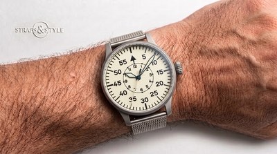 Laco pilot watch with a cream flieger dial, inner hours circle, luminous sword hands, onion crown and a grey mesh bracelet