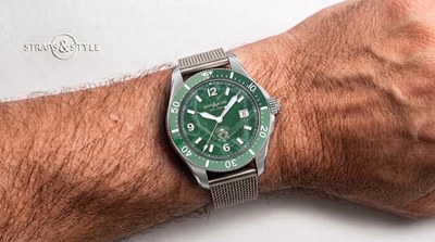 Montblanc diver with a green textured glacier dial, white luminescent numerals, a date at three and a matching green dive bezel on a Straps&Style mesh bracelet
