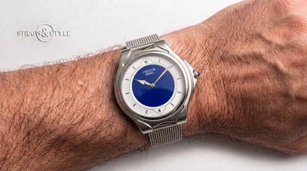 Credor ultra-thin dress watch with glossy blue enamel centre and white chapter ring on a Straps&Style mesh bracelet