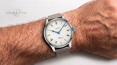 STOWA dress watch with a white dial, black Roman numerals, blued hands, an onion crown and small seconds at six on a Straps&Style mesh bracelet