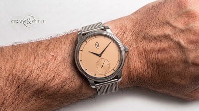 Parmigiani Fleurier dress watch with a salmon matte dial, leaf hands and a small-seconds counter at six on a Straps&Style mesh bracelet