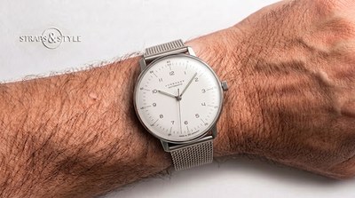 Junghans Max Bill Automatic with a silver-white dial, slim Arabic numerals, a fine central seconds hand and a steel mesh bracelet