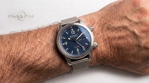 Bremont blue-dial pilot watch on a Straps&Style mesh bracelet