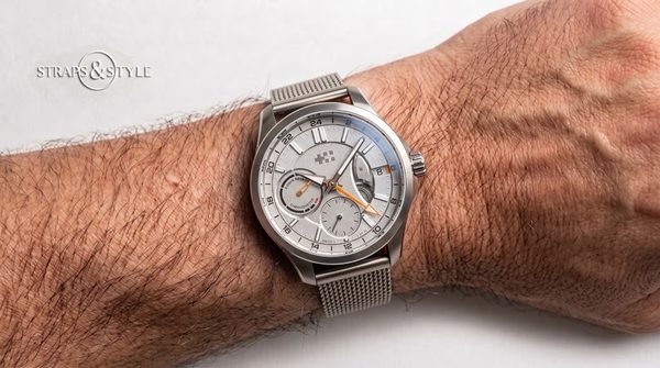 Christopher Ward C1 silver dial with power reserve on a Straps&Style mesh bracelet