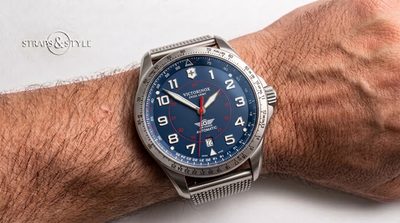 Victorinox Swiss Army Air Force Automatic pilot watch with a blue dial, white numerals and a red inner 24-hour track on a Straps&Style mesh bracelet