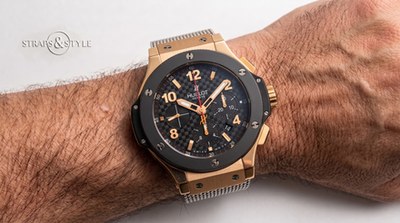 Hublot Geneve chronograph with a black carbon-pattern dial, gold markers and a rose-gold-tone case on a Straps&Style mesh bracelet