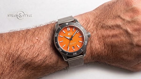 Christopher Ward C60 Chronometer with orange dial on a Straps&Style mesh bracelet