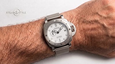 Panerai Submersible diver with a white dial, black-rimmed luminous markers, rotating dive bezel and a date at three on a Straps&Style mesh bracelet