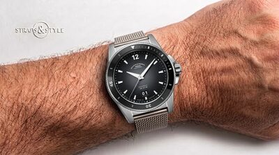Mühle Glashütte ProMare diver with a matte black dial, black rotating dive bezel, crown guards at four and a date at six on a Straps&Style mesh bracelet
