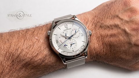 Jaeger-LeCoultre Master Control Geographic with a silver dial, blue hands, date ring and a city ring around the bottom on a Straps&Style mesh bracelet