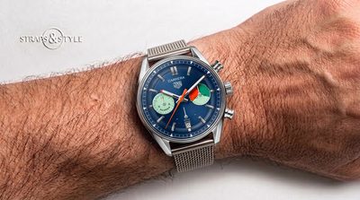 TAG Heuer regatta chronograph with a blue dial, green and orange timing subdials, a date at six and a polished fixed bezel on a Straps&Style mesh bracelet