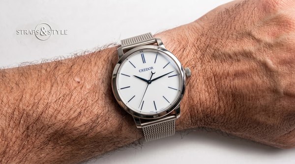 Credor porcelain-white dial with blue markers and blued hands on a Straps&Style mesh bracelet